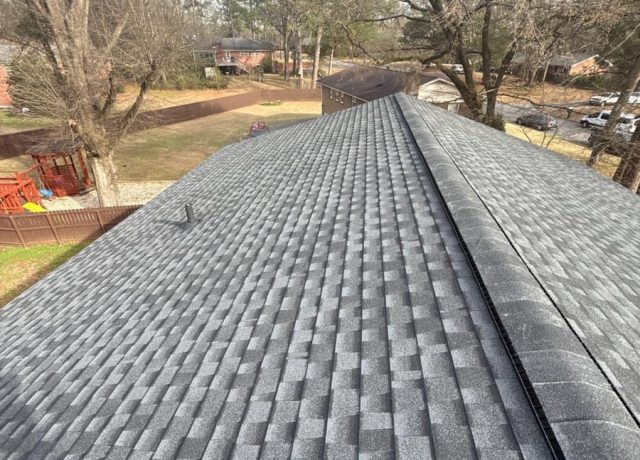 Gray shingle roof with a capped ridge vent above a fenced yard in Montevallo, AL